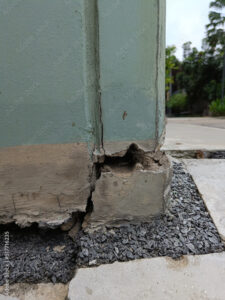 Cracked concrete building or pillar cement wall broken at the outside effect with earthquake