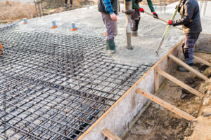 pouring concrete slab - foundation of new house